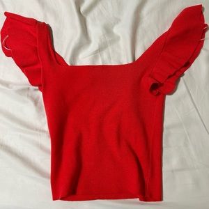 red cropped top with wing arms
